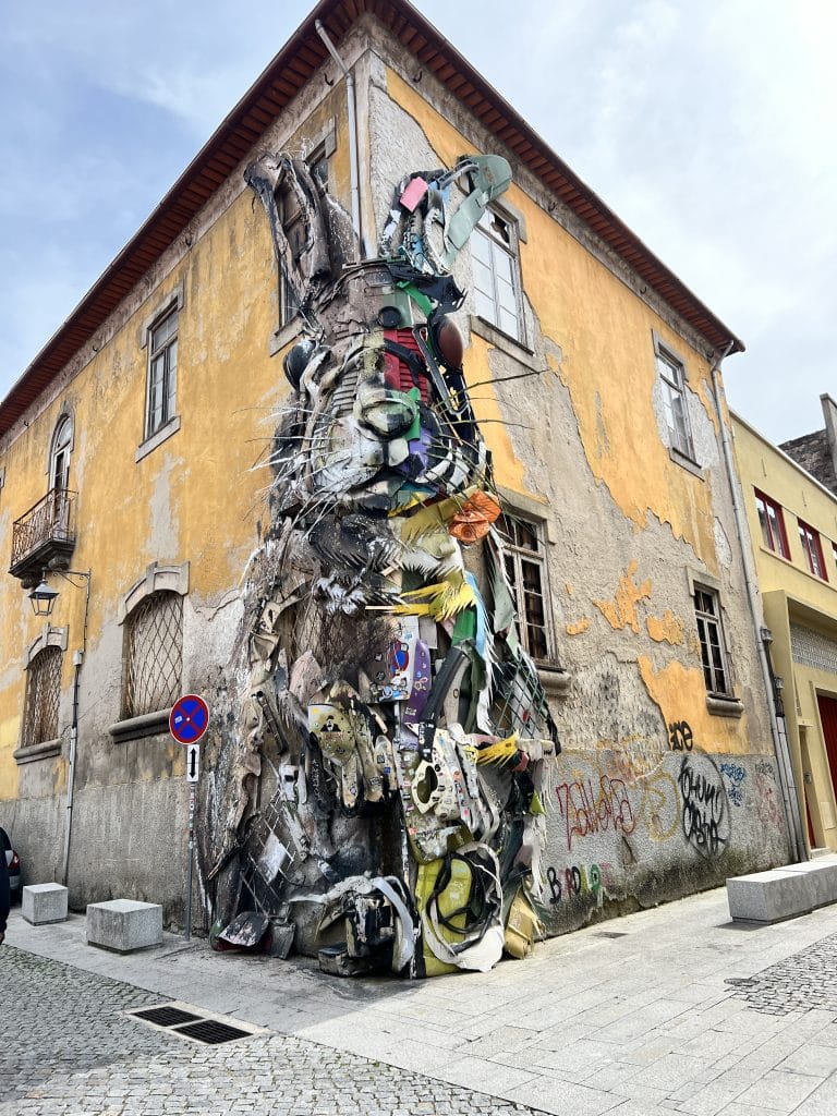Graffiti art in Porto, Portugal. Rabbit with mixed media recycled trash by famous Bordalo II.